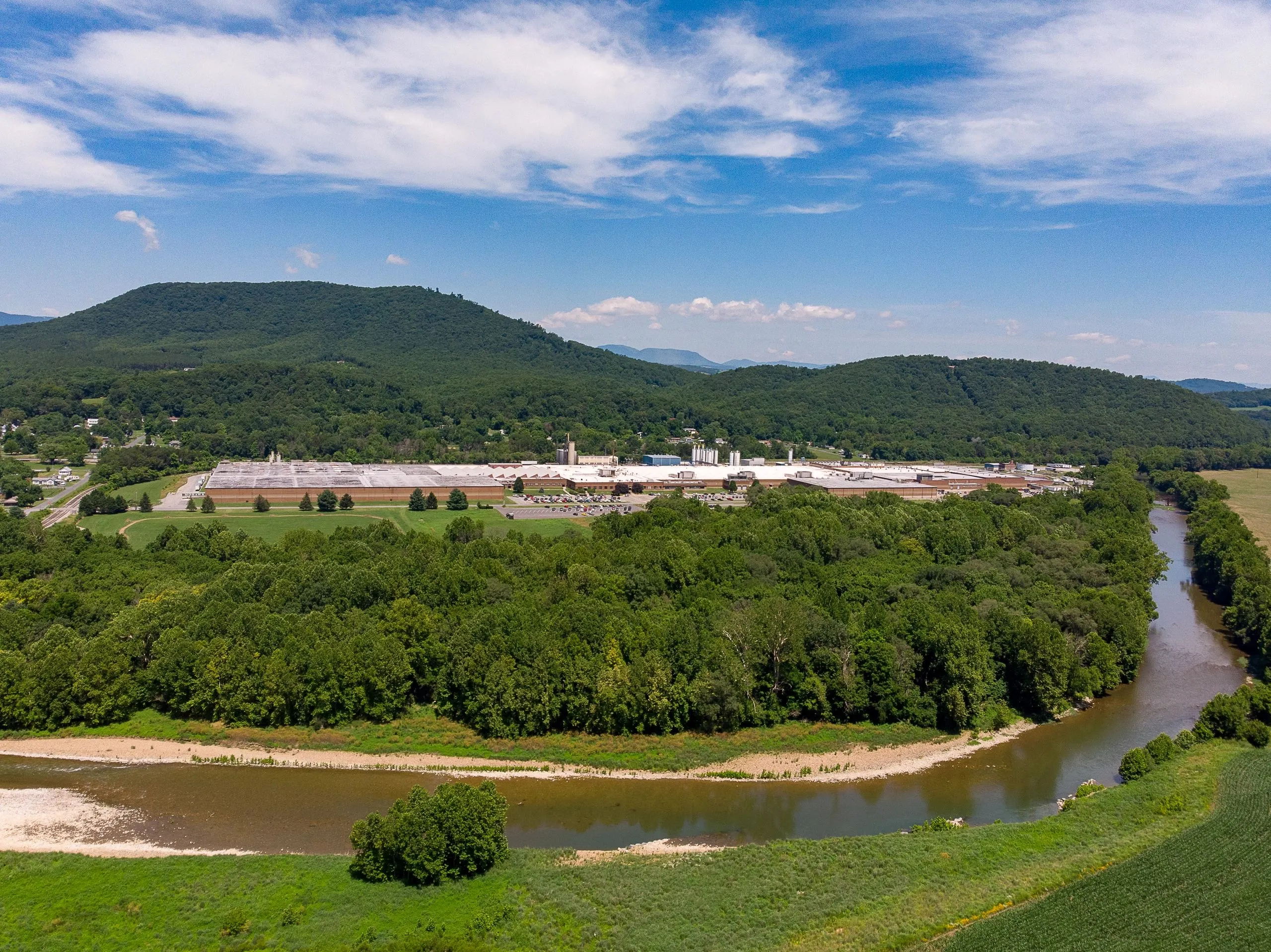 The carpet mill complex and the curve of the Maury River seen from above.